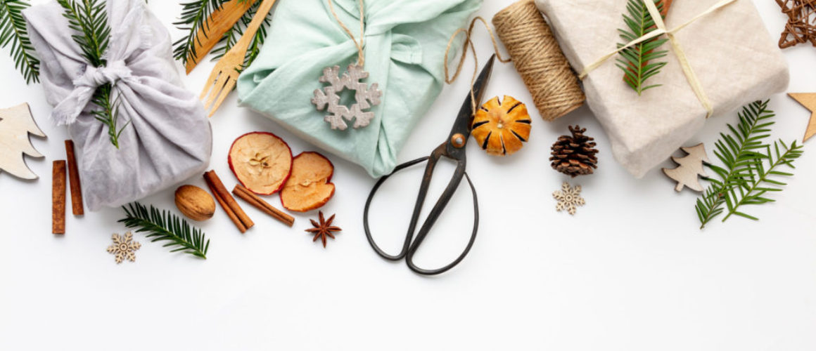 Fabric wrapped gifts and wooden Christmas decorations