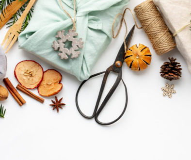 Fabric wrapped gifts and wooden Christmas decorations